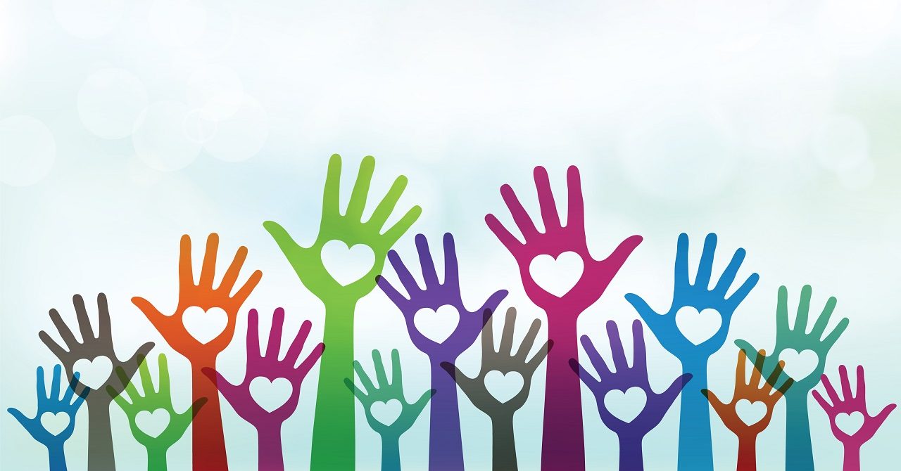 Several People Seated In A Meeting Space